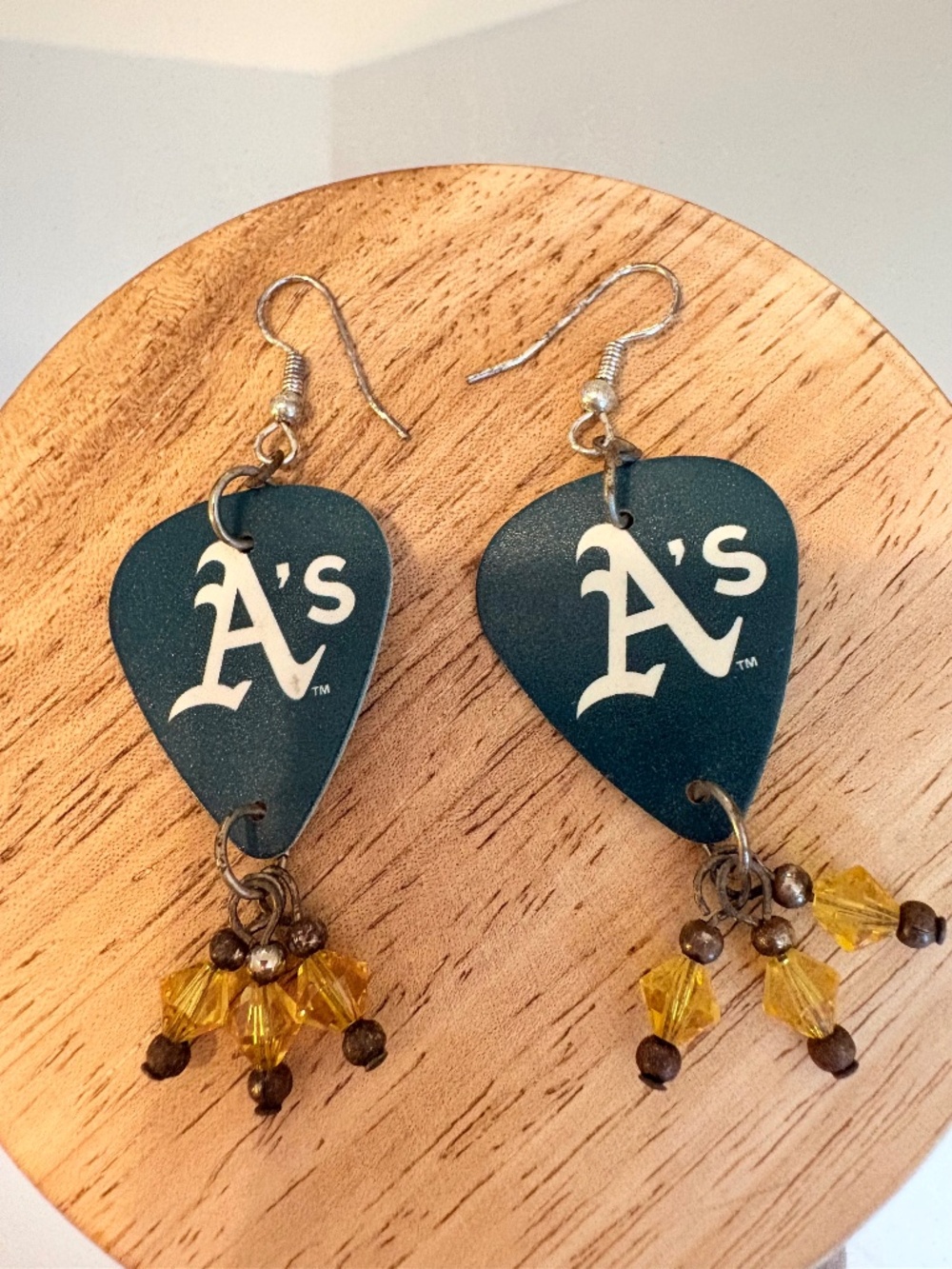 A’s MLB Guitar pick earrings with yellow and green beading detail